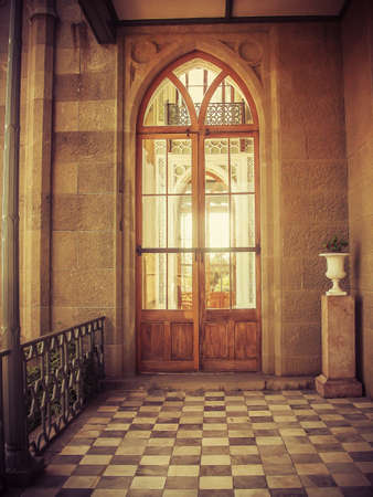 Glass door in old castleの写真素材