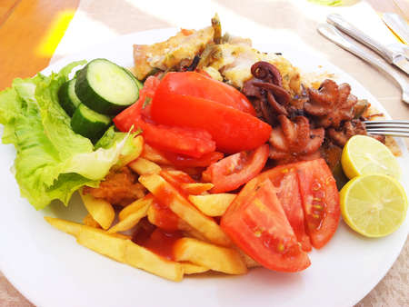 Bright photo of food on a white plateの写真素材