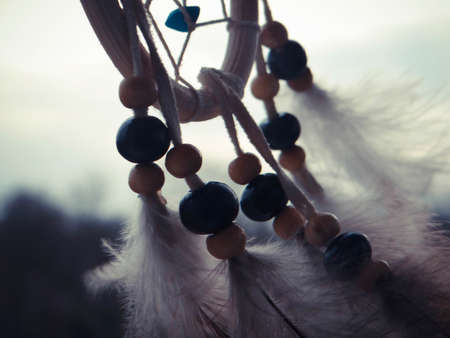 Wooden Dreamcatcher with feathers and beadsの写真素材