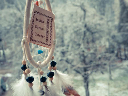 Photo of dream catcher on a winter forestの写真素材