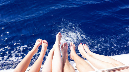 Stylish beautiful legs on a ship yacht in the blue sea background