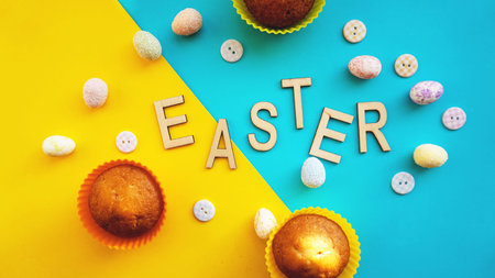 Decor Easter eggs on blue background. Flat lay, top view. Easter concept banner. Easter textの写真素材