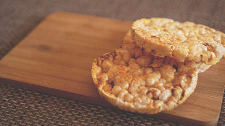 Composition with crunchy rice cakes on wooden background, side view - soft focus, healthy foodの写真素材