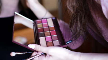 Hand use palette colorful and brush set makeup, beauty and fashion. Preparing make-up for the...