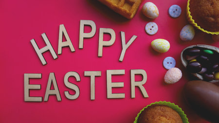 Decor Easter eggs on pink background. Flat lay, top view. Easter concept banner. Happy Easter text