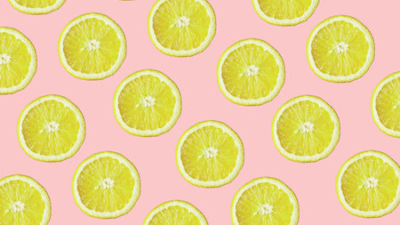Top view of colorful fruit pattern of fresh lemon on modern pink background