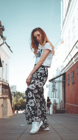 Fashion portrait stylish pretty woman in sunglasses posing in the city, street fashionの写真素材