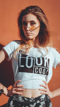 Fashion portrait stylish pretty woman in sunglasses posing in the city, street fashion. You look...