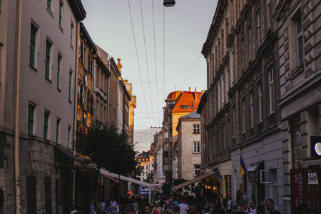 Lviv. Ukraine 29 June 2019 Evening lights and sunset in city centr. Cafes, people, summertime.のeditorial素材