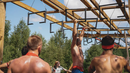 Minsk Bularus. July 28, 2019 Sunny day. Sports competitions in nature. Men performs an exercise