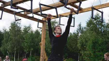 Minsk Bularus. July 28, 2019 Sunny day. Sports competitions in nature. Men performs an exercise