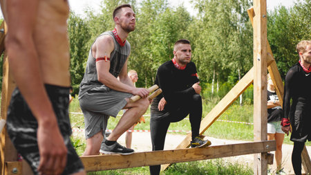 Minsk Bularus. July 28, 2019 Sunny day. Sports competitions in nature. Men performs an exercise