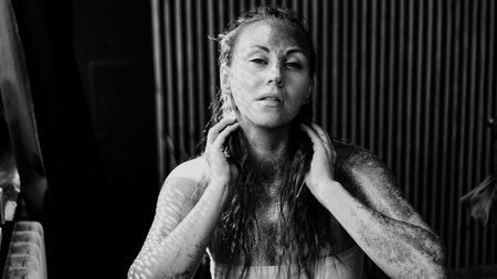 Portrait of beautiful woman with sparkles on her face. The concept of Individuality, Black and white
