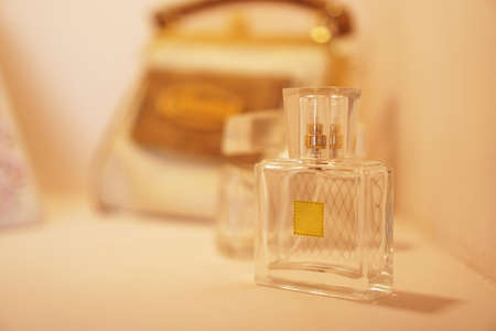 Bottle gift toilet water perfume on a background of blurred lights. Side view.の写真素材