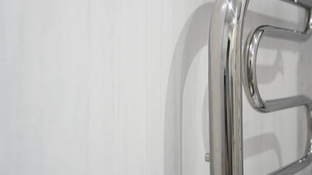 Modern bathroom towel dryer - white bathroom interior backgroundの写真素材