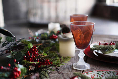 Christmas and New Year dinner decor on blurred background with light from windowの写真素材