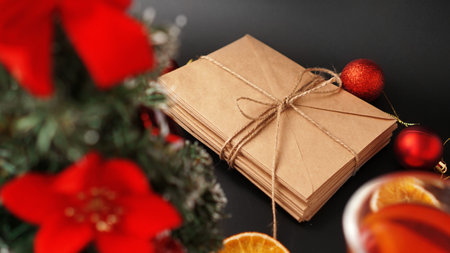 Christmas composition. Xmas festive decoration with letters on black backgroundの写真素材