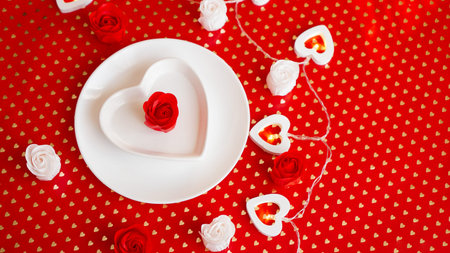 Place setting in red and white - for Valentine or other event. White plate in the shape of a heart...