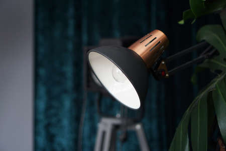 Photo studio lighting equipment on black and blue background indoorの写真素材