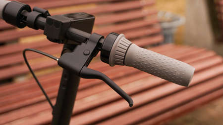Close-up of the steering wheel of an electric scooter outsideの写真素材
