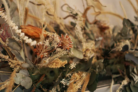 Beautiful and delicate bouquet of dried flowers in interiorの写真素材