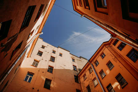 Russia. Old courtyards in the center of St. Petersburg in the summer. Bottom up viewの写真素材