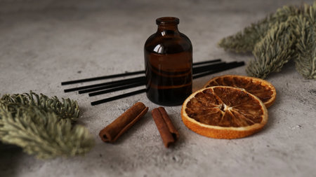 Citrus reed diffuser with cinnamon, dry orange and fir tree branches. Parfum for home. Perfume making trainingの写真素材