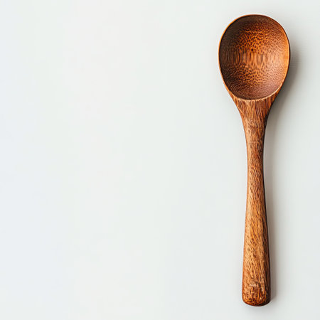 A simple wooden spoon, perfect for cooking and serving.の素材