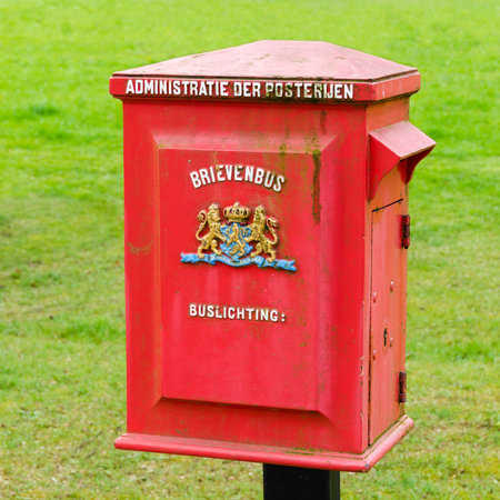 A Dutch old red metal postbox