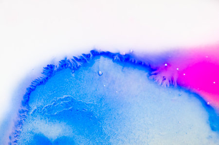 liquid bright aquarel colors with oil generate fluid structures and bubbles in red, orange, yellow, blue, white and pinkの写真素材