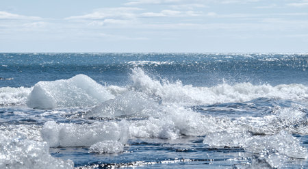 Icebergs on the black sand beach in Jokulsarlon, Icelandの写真素材