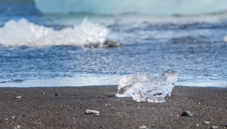 Icebergs on the black sand beach in Jokulsarlon, Icelandの写真素材