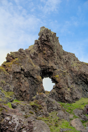 Icelandic landscape with volcanic rock formations and lava fields in summer near Dritvik, Snaefellsnes peninsulaの写真素材