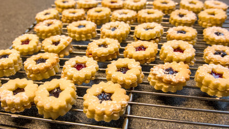Close up of cookies with jam on a cooling rack. Selective focus. Christmas