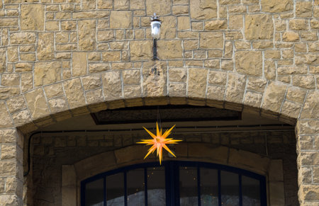 A star-shaped light in the entrance of a medieval castle.の写真素材