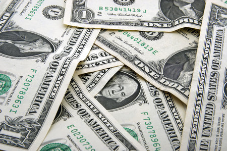 Background of One dollar bills in chaotic arrangement