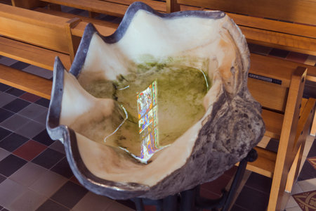 Reflection of a stained glass window in the holy waterのeditorial素材