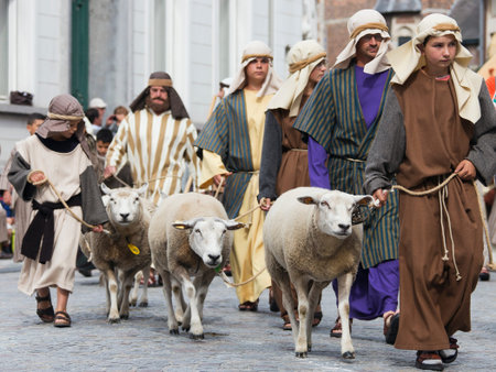 Shepherds in mid-eastern clothing hung march through the streetのeditorial素材