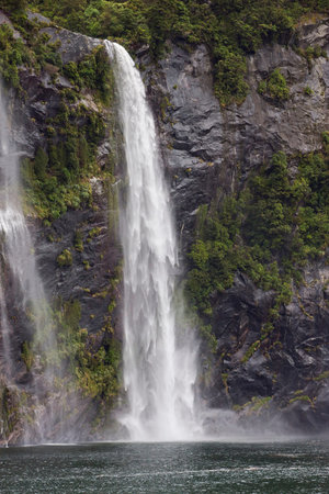 Swollen waterfall after the rain in Milford Soundの写真素材