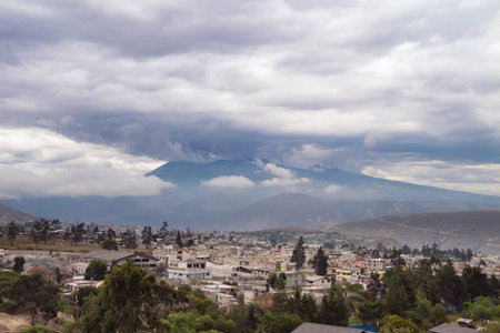 Heavy weather gathering around the volcanoes surrounding Quito. Haze and atmospheric disturbance...