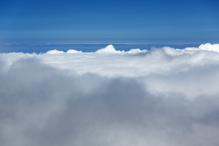 Above the clouds on Haleakala. Near the horizon, some patches of ocean are visible.