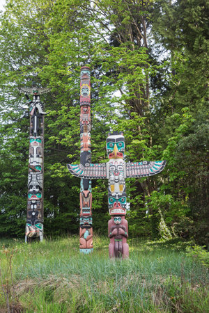 Vancouver, April 26, 2016: Totem poles in Stanley Park. These totem poles are one of the most visited attractions.のeditorial素材