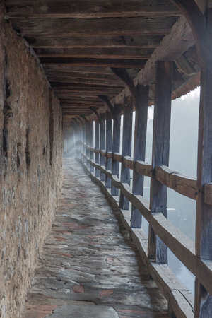 Fog on the city walls of Rothenburg, early in the morningの写真素材