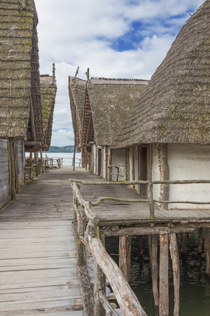 Unteruhldingen, Baden-Wurttemberg, Germany, October 3, 2016 - Wooden boardwalk between stilt houses at the Lake dwelling museum in Unteruhldingenのeditorial素材