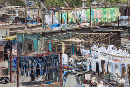 Editorial: MUMBAI, MAHARASHTRA, INDIA, April 12, 2017 - Laundry drying in the Mahalaxmi Dhobi Ghat open air laundromat in Mumbaiのeditorial素材