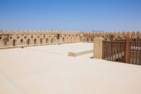 On the top level of the Jabrin Castle, behind the battlementの写真素材