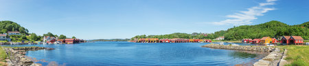 Panorama at the waterfront of Svennevik with its boat houses