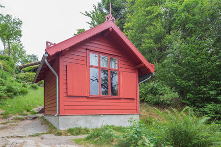 Editorial: BERGEN, HORDALAND NORWAY, June 10, 2018 - Back side of the hut near Edvard Grieg's house in the garden, overlooking the lakeのeditorial素材