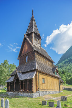 Editorial: ORNES, SOGN OG FJORDANE, NORWAY, June 12, 2018 - Side view of the stave church in Ornes with its cemeteryのeditorial素材