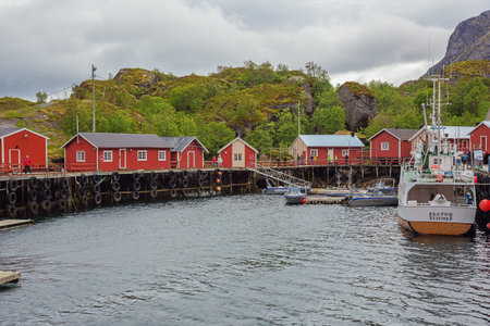 Editorial: NUSFJORD, NORDLAND, NORWAY, June 22, 2018 - The U shaped harbor of Nusfjord, a traditional fishing village along the Vestfjordenのeditorial素材